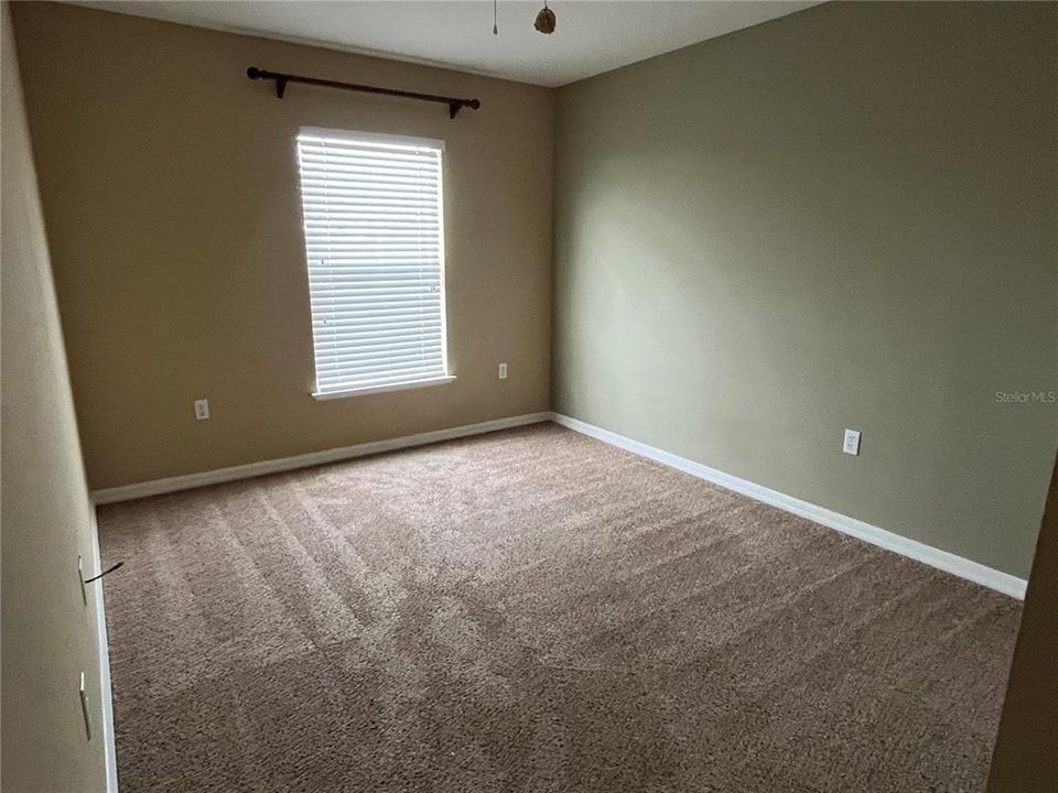 Bedroom 3 with ceiling fan and new blinds