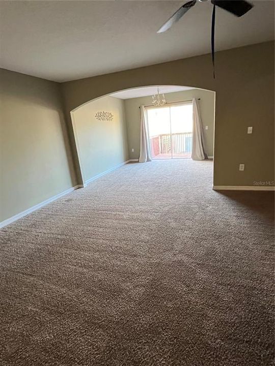 Living and Dining areas surround the kitchen