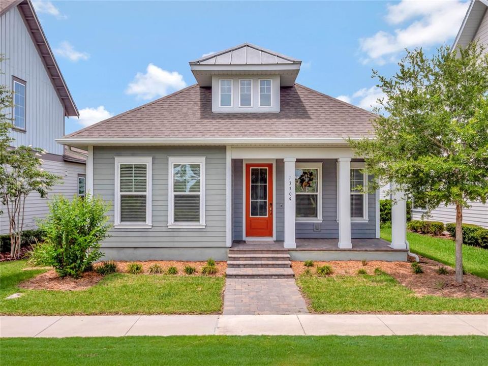 Covered front porch with brick pavers