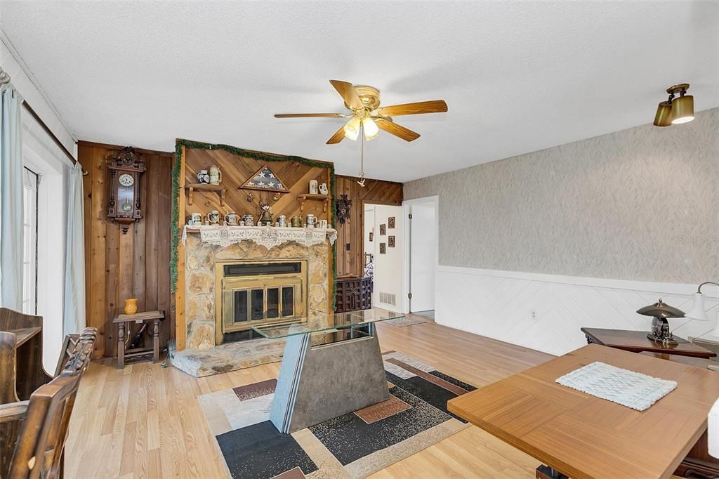 Family Room with wood burning fire place. (in process of moving)