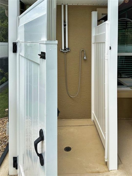 Private outdoor shower enclosure, offering convenience and privacy.