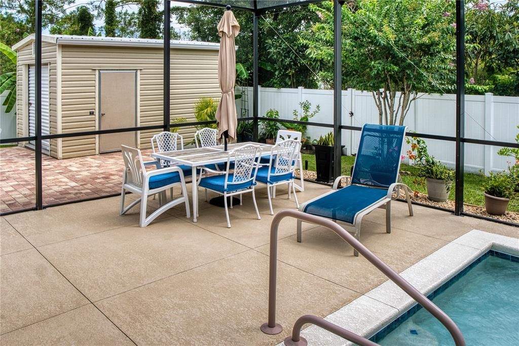 Large pool deck area, perfect for outdoor furniture, sunning, and more, creating an ideal space for relaxation and entertainment.