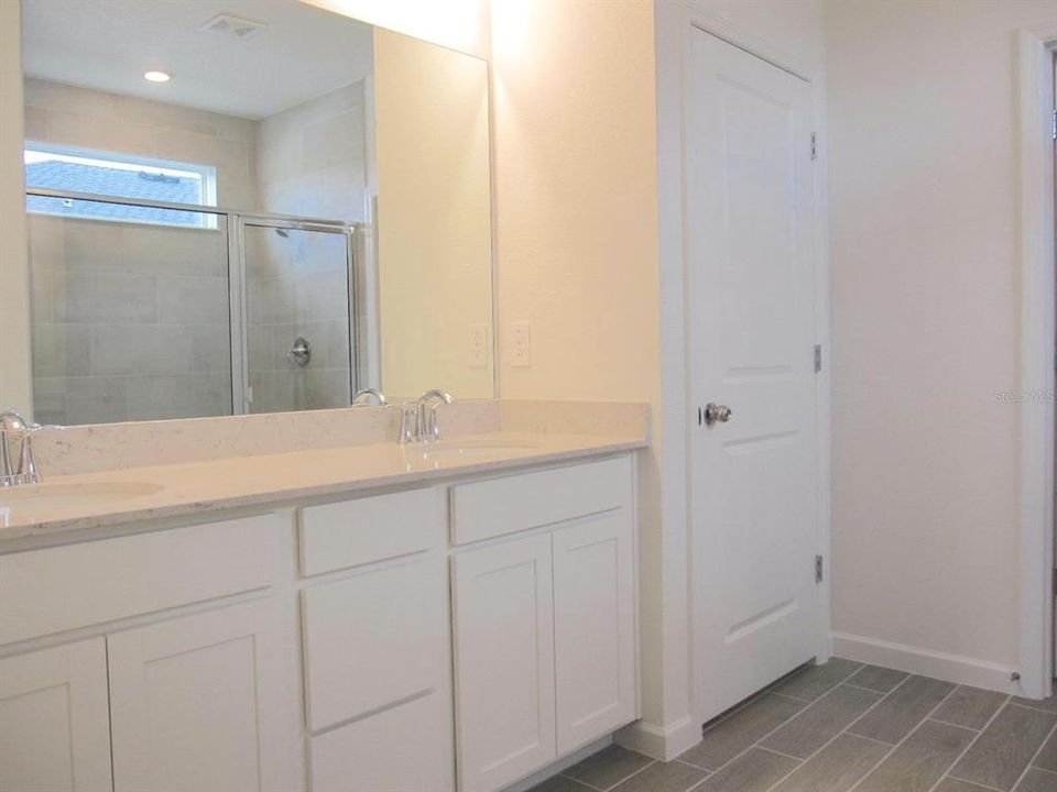 Primary bathroom dual vanity sink area