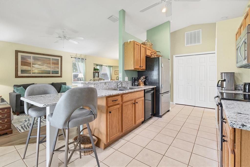 Kitchen and breakfast bar, stainless appliances