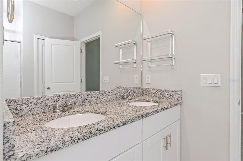 Ensuite bathroom with shower and vanity