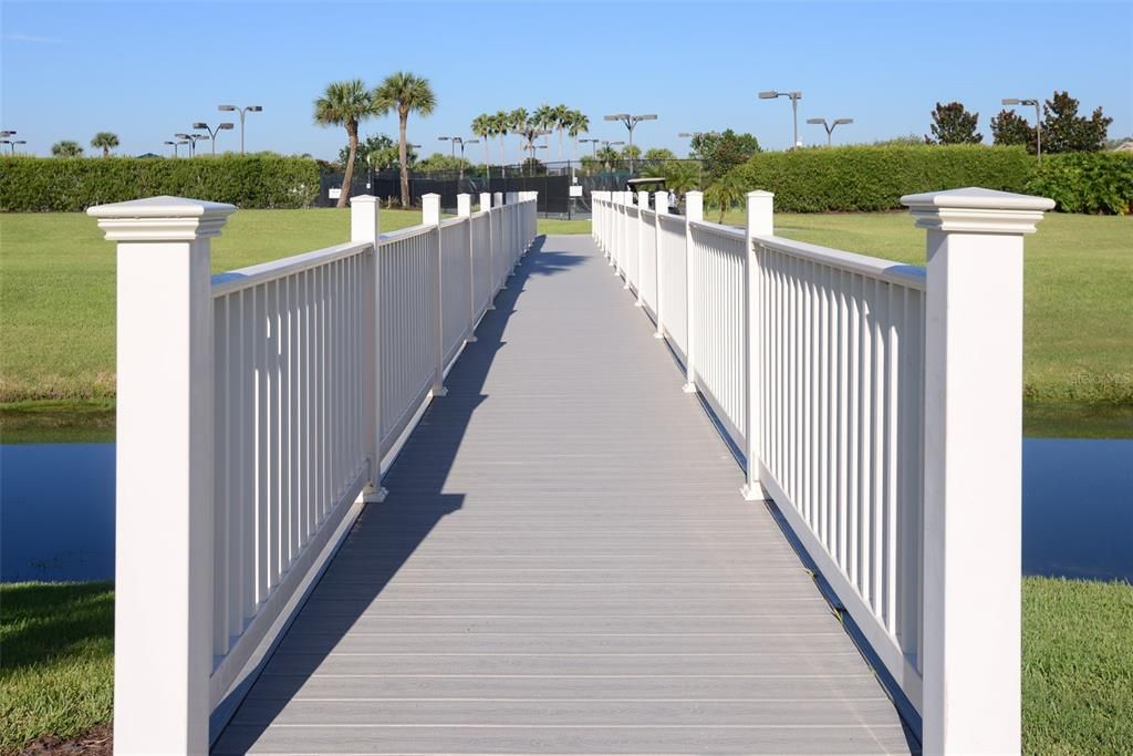 Just a short walk over this foot bridge is the tennis and pickleball facility.