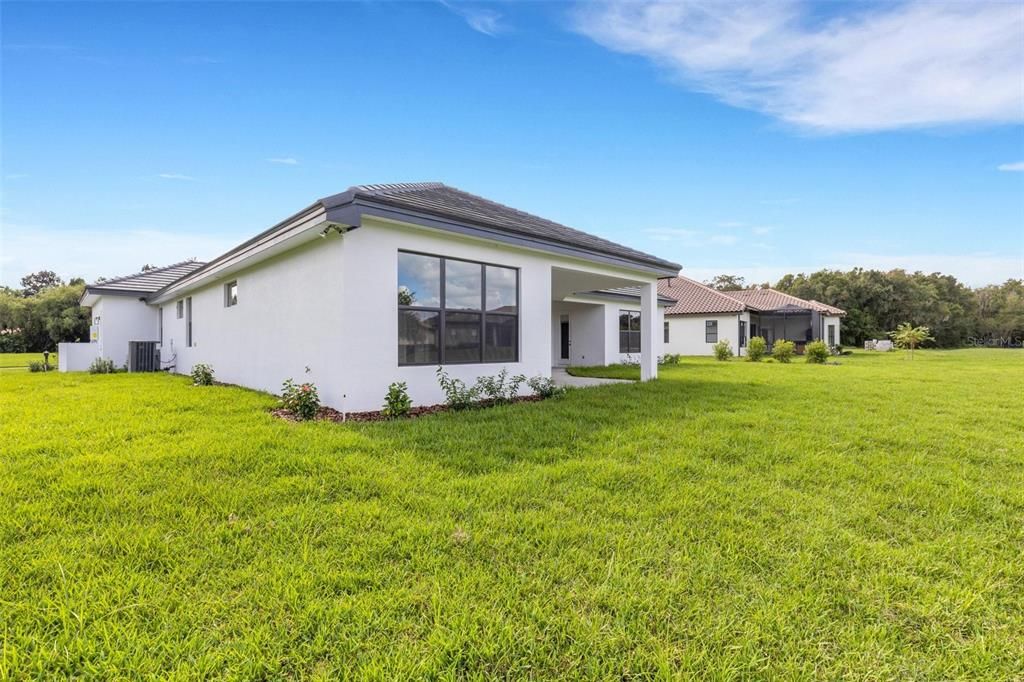 Large lot with plenty of green space in the backyard.