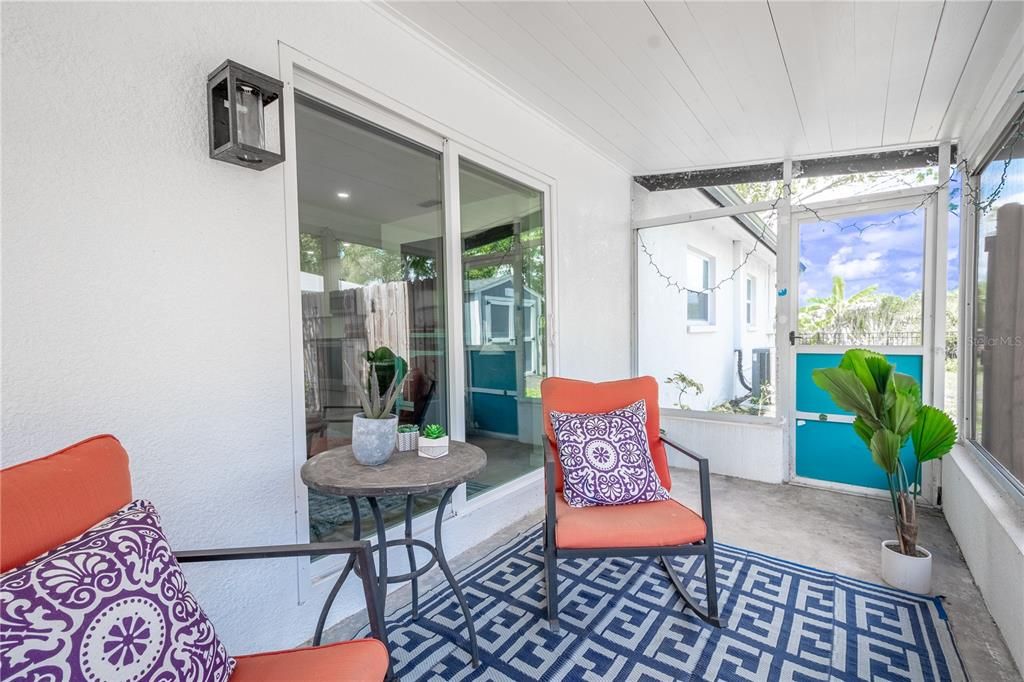 The screened in side porch adds yet another space to relax and unwind.