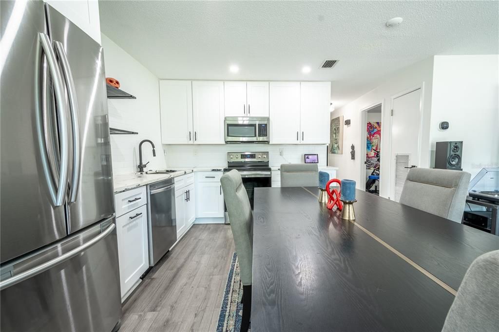 The kitchen is spacious enough to accommodate a large dining table.