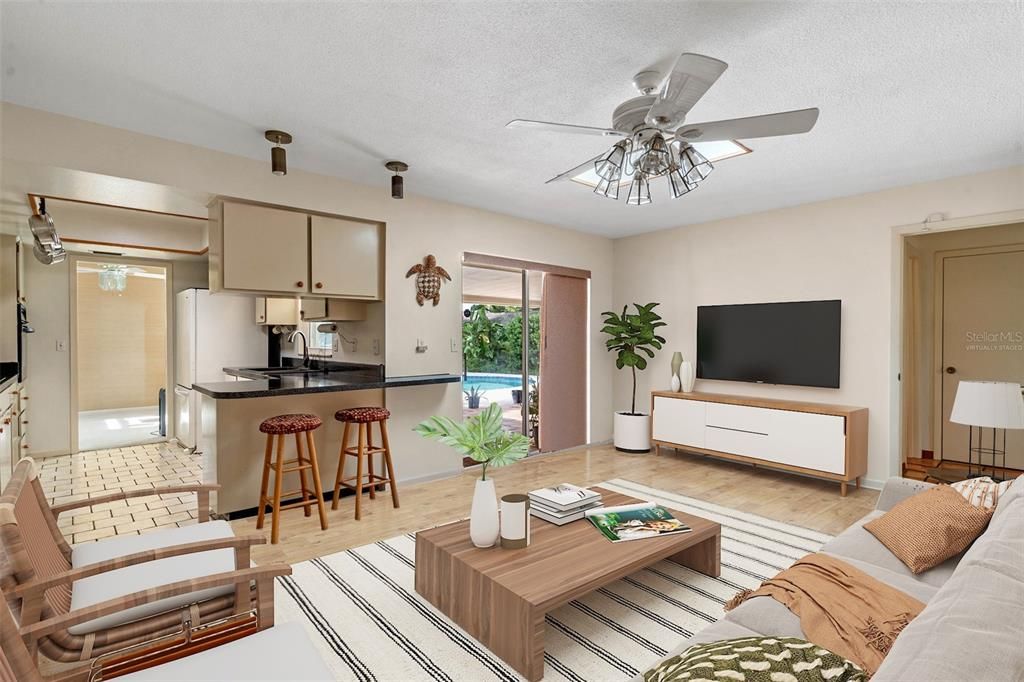 Virtually Staged - Family Room - overlooking the kitchen and pool.