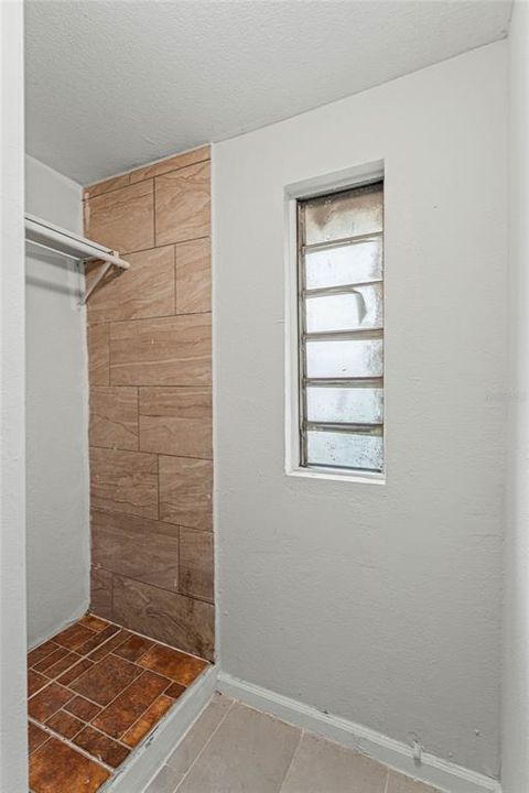 Tiled Out Area in Primary Walk in Closet