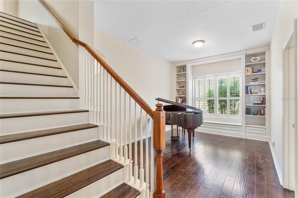 Stairwell to loft with hardwood floor