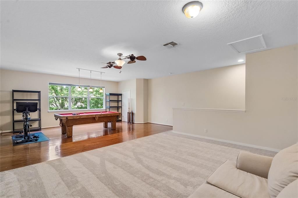 Loft with hardwood floor and new carpet