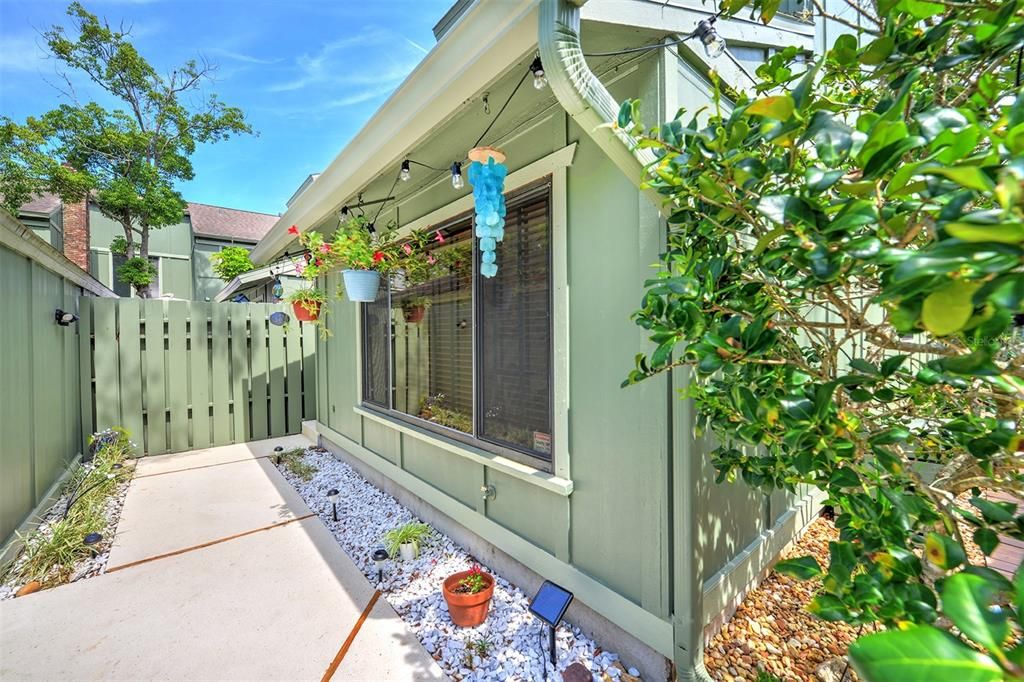 Walkway to entrance of home. Hardie board exterior on home and garage.