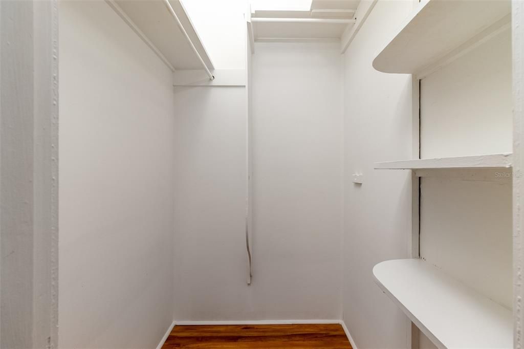 Bedroom features a large walk in closet