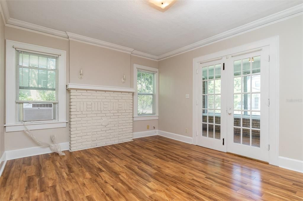 French doors and a decorative fireplace