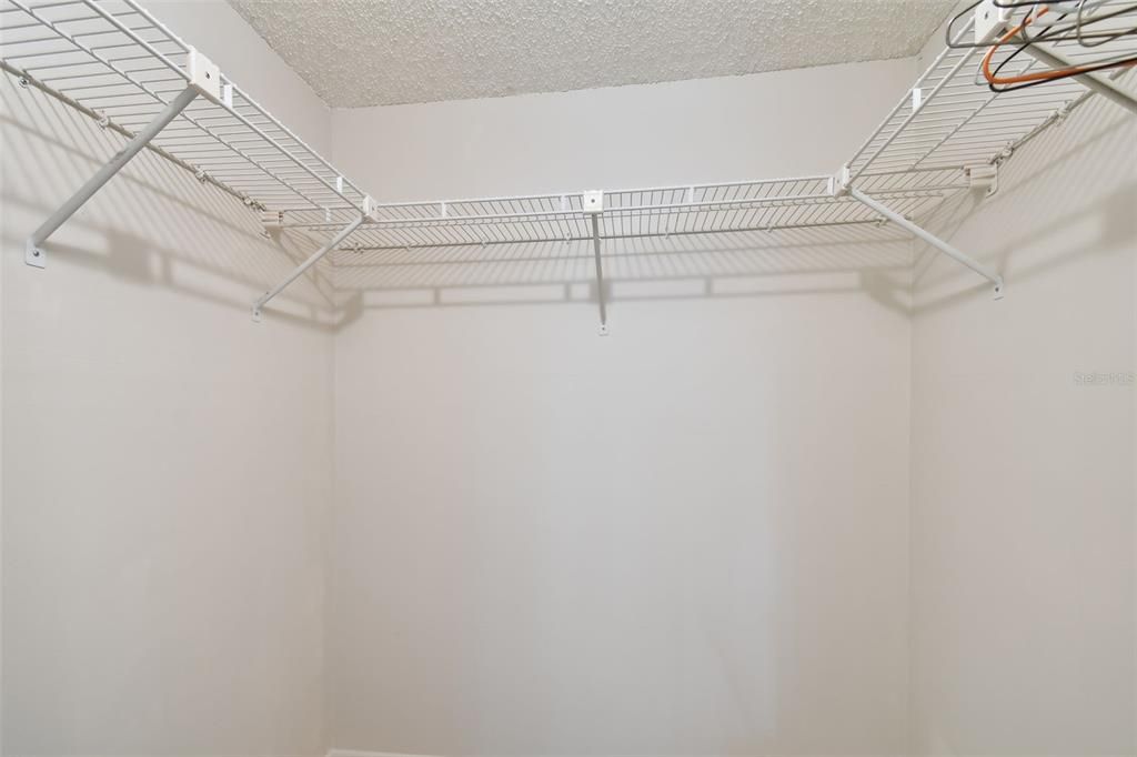One of two closets in primary bedroom