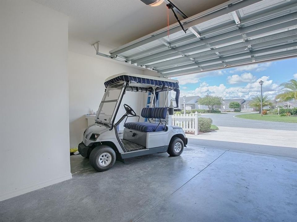 1.5 GARAGE - GOLF CART IS INCLUDED WITH THE HOME.