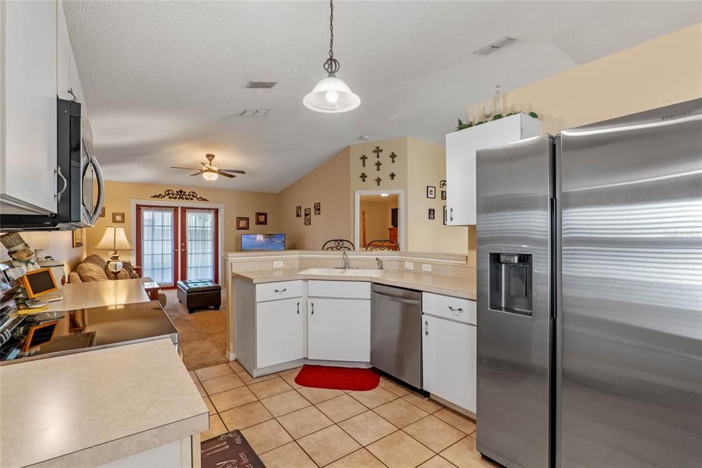 Stainless Steel Appliances in kitchen with view of family room.