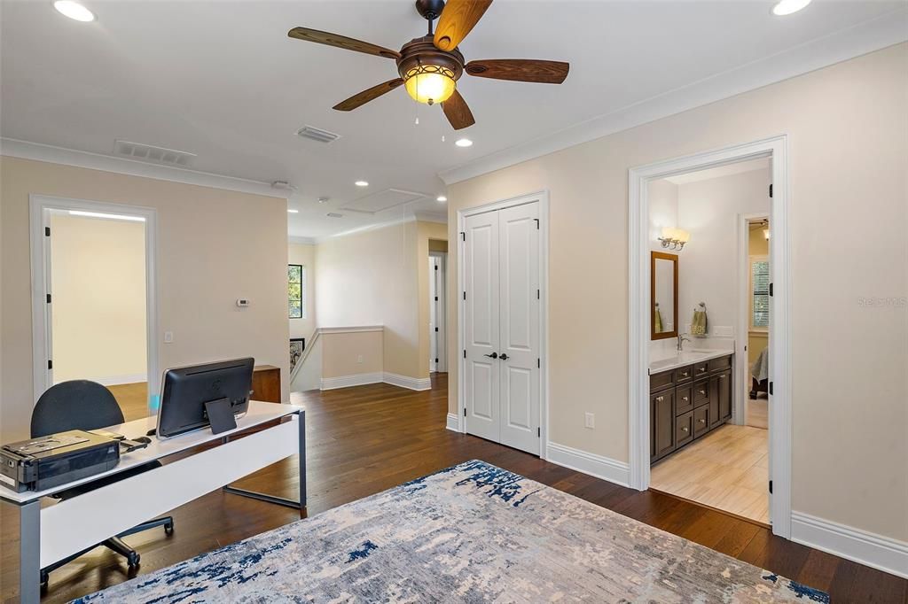 Upstairs living room area. Could easily be converted into another bedroom if you added a wall and door. It is already attached to the Jack and Jill style bathroom and has a closet and window.