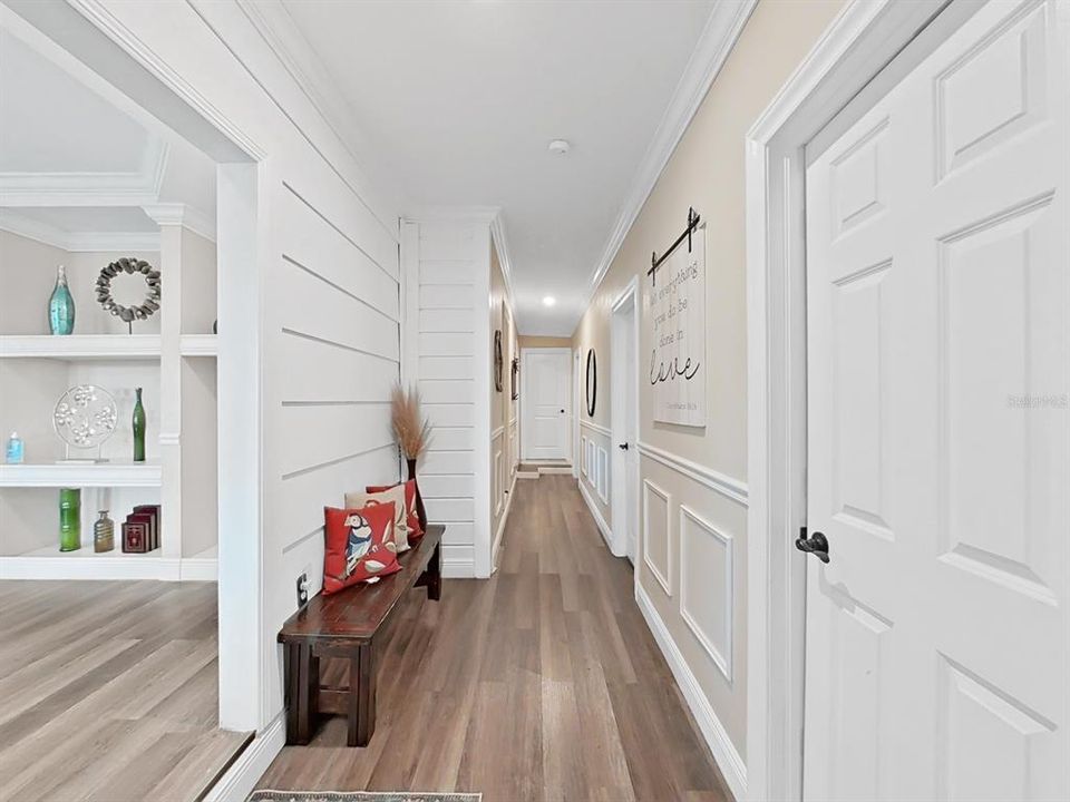 Hallway leading to five bedrooms and two full bathrooms