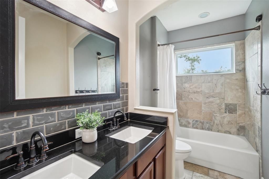 Upstairs laundry room is conveniently located across from secondary bedrooms