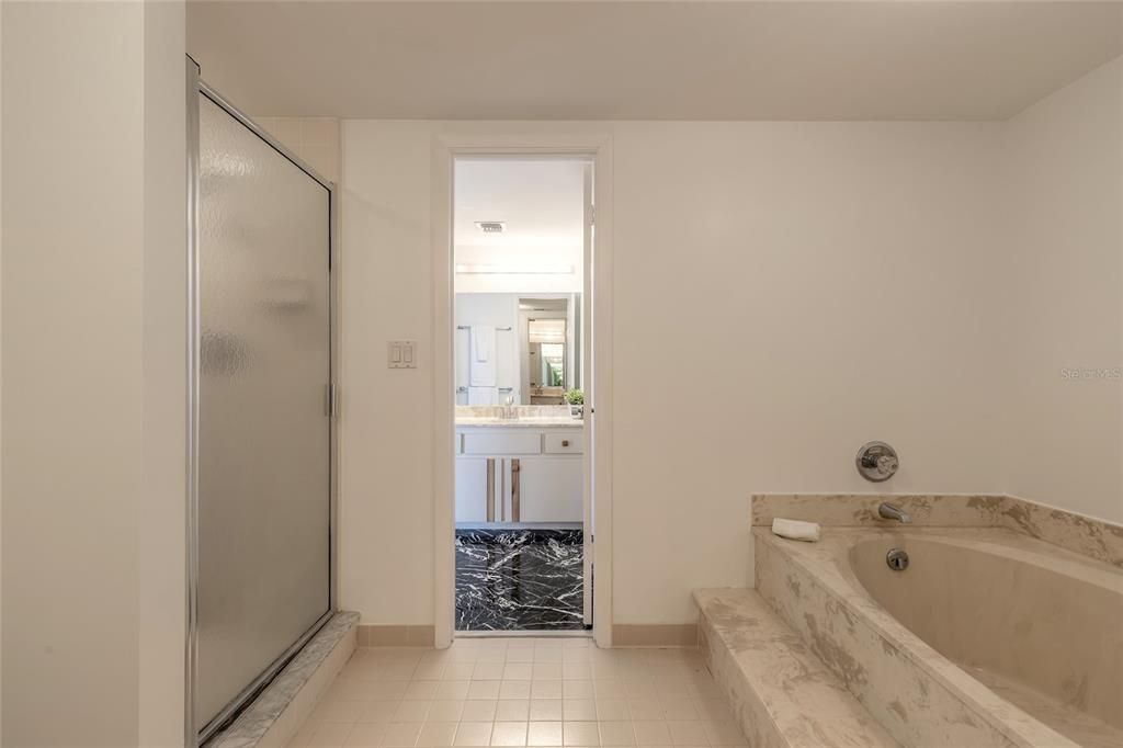 primary bath w/ his and her sinks /tub & shower