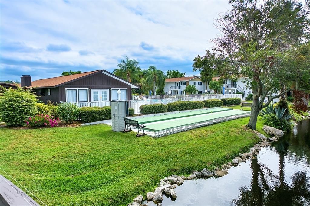 Shuffleboard courts, clubhouse and one of two pools