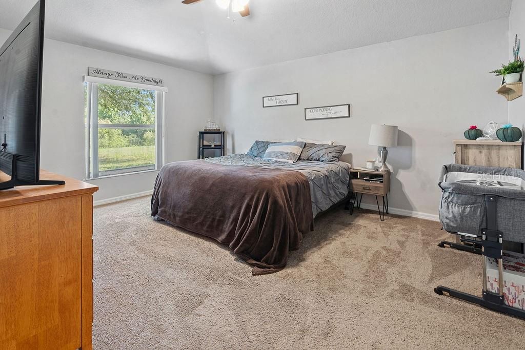 primary bedroom with ensuite bathroom and double walk-in closets