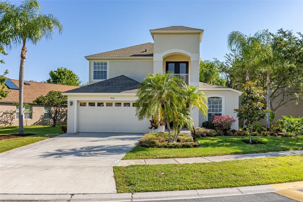 Front Exterior. Painted and New Roof 2022. Landscaped with Palms, dessert rose and various plants.