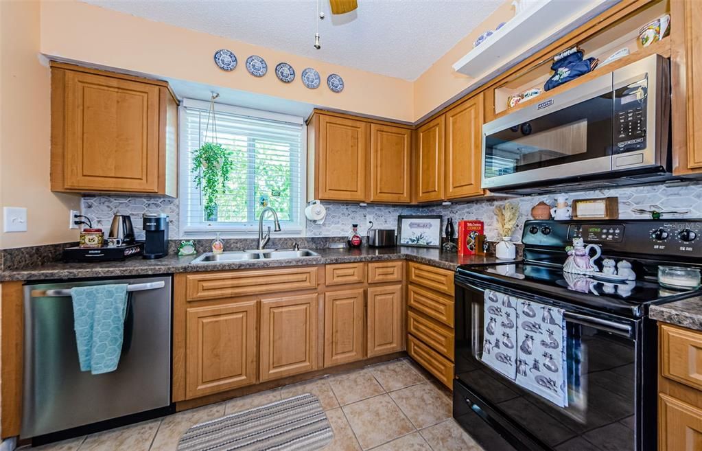 Bright and Light kitchen has a ceiling fan