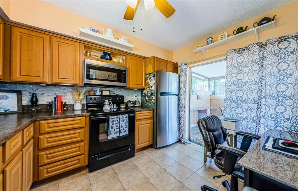 Sliding glass doors lead to your lanai, perfect for your morning cup of coffee