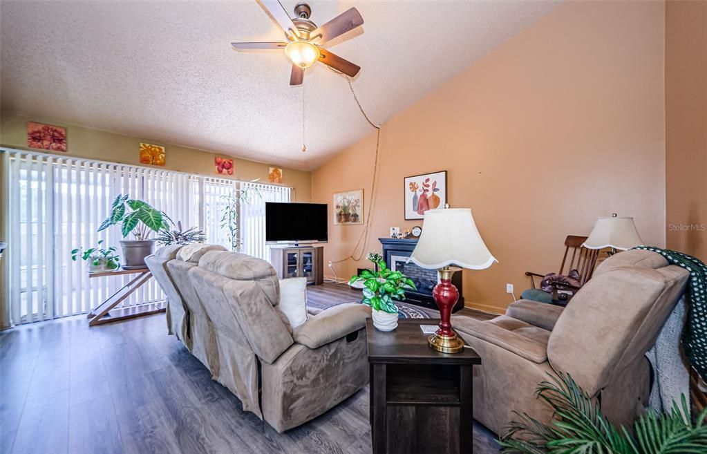 Enter into your great room with vaulted ceilings and sliding glass doors that lead to your 29x8 lanai