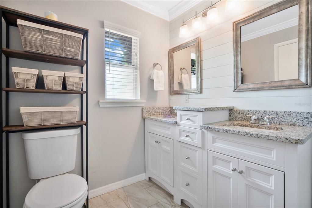 Primary Bathroom featuring dual sink vanity with plenty of storage