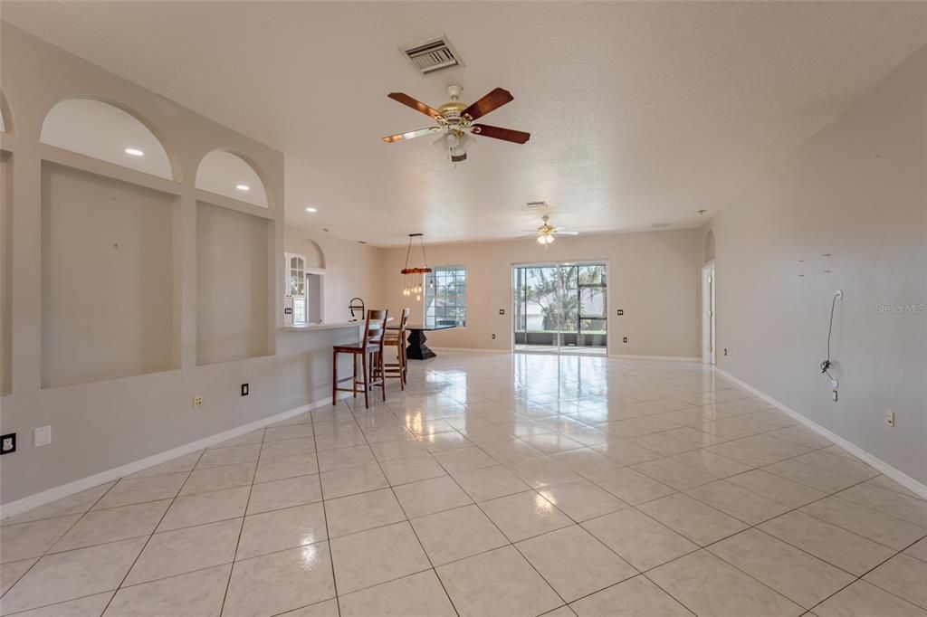 FAmily Room Kitchen Breakfast Bar and Sliders to Porch