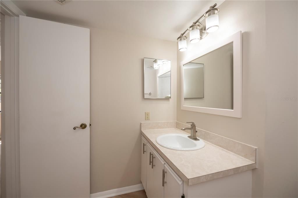 Second Bath W/ Newer Vanity, Sink, Mirror, & Plumbing Fixtures