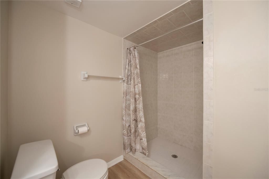 Walk In Shower In Second Bath W/Newer Tile walls & New Luxury Vinyl Floors