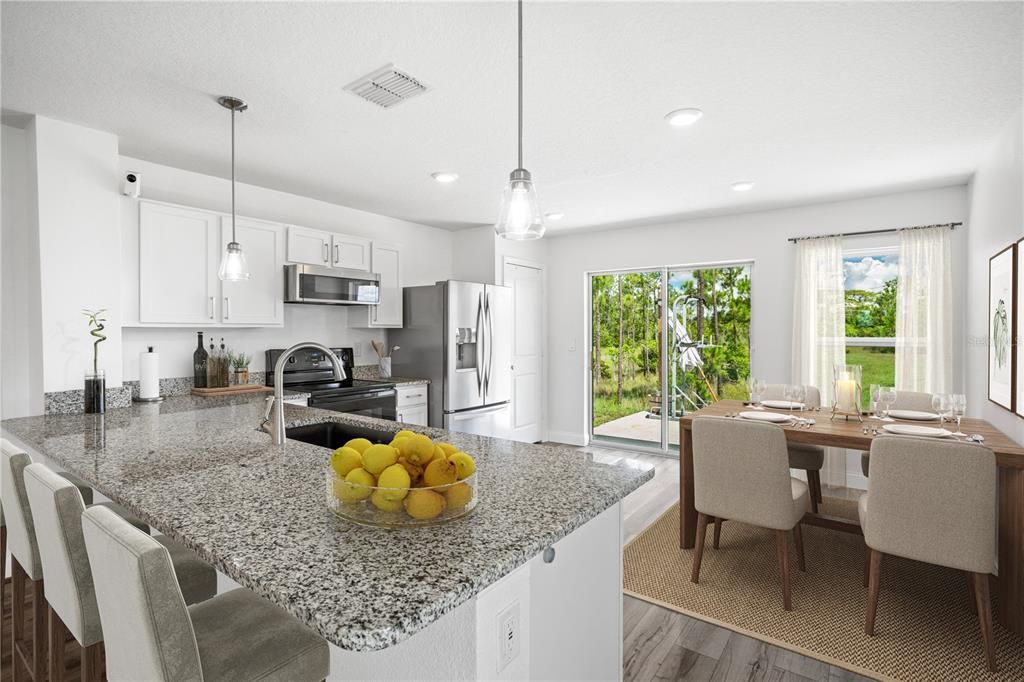 Spacious Kitchen with dine in space.  Ritually staged picture.