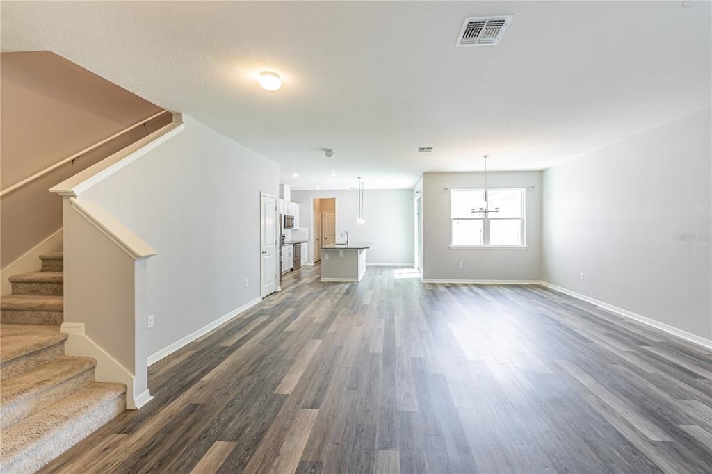 Great Room View to Stairs and Kitchen