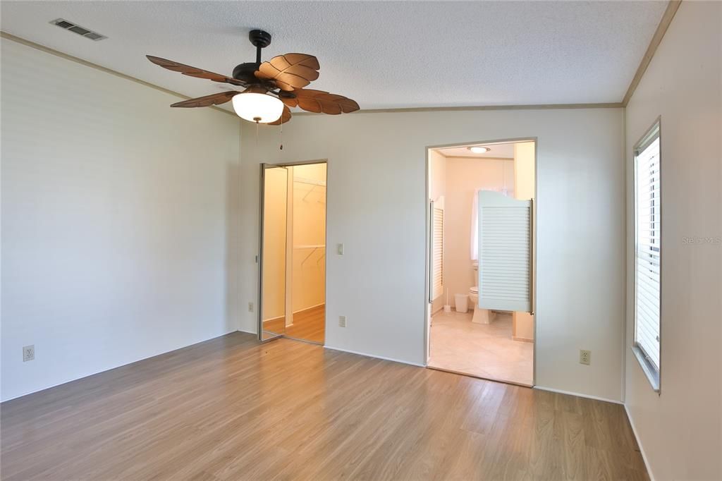 Entry to Primary Bedroom Walk In Closet & Full Bath