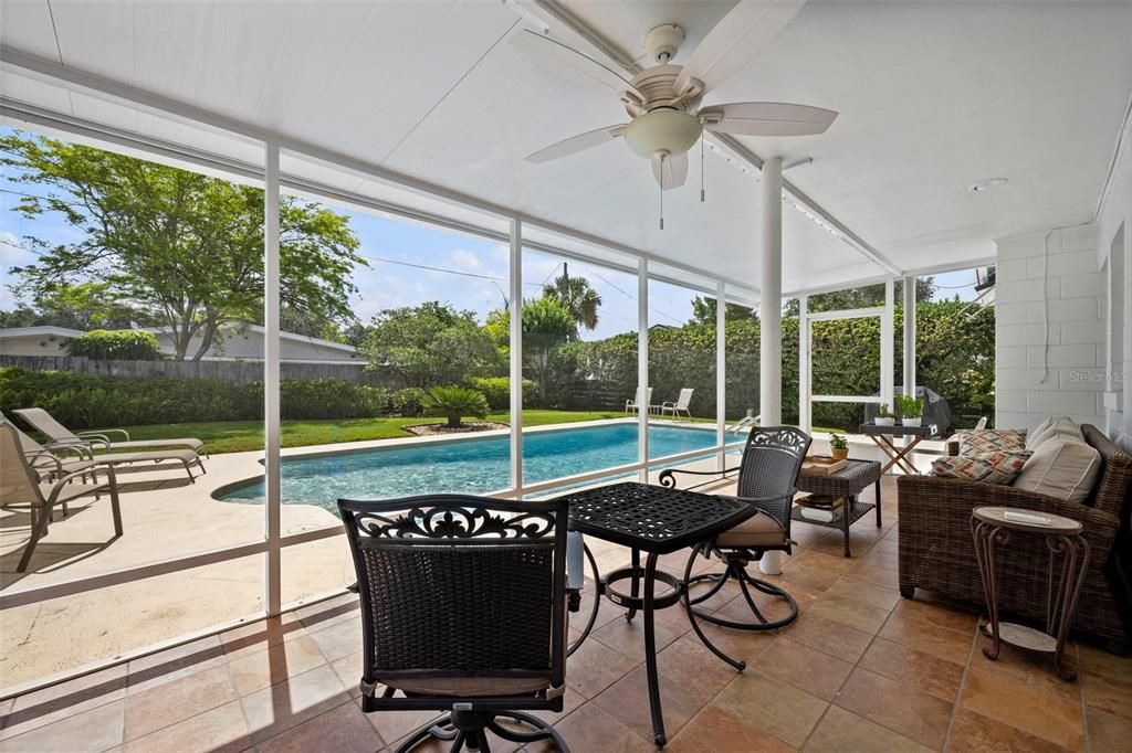 Enjoy morning coffee or evening wine in this generous screened in lanai