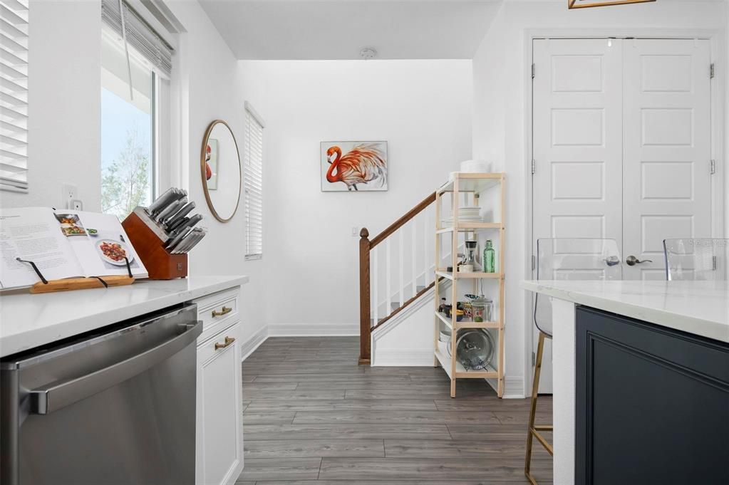 Kitchen and stairs to upper level with bedrooms