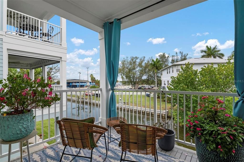 Main level screened terrace overlooking the canal