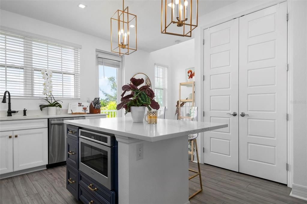 Kitchen with quartz counters and island