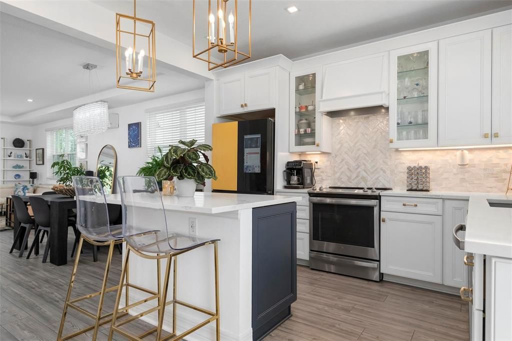 Kitchen with upgraded appliances and quartz counter tops