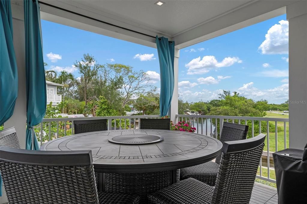 Main level screened terrace overlooking the canal