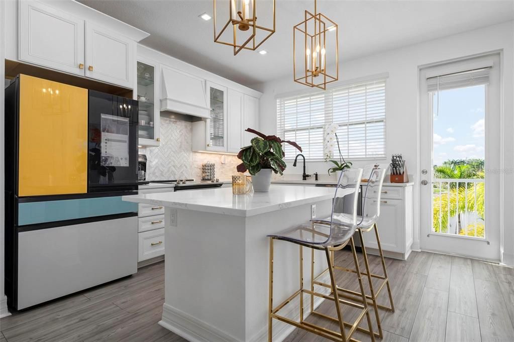 Kitchen with quartz counters and island