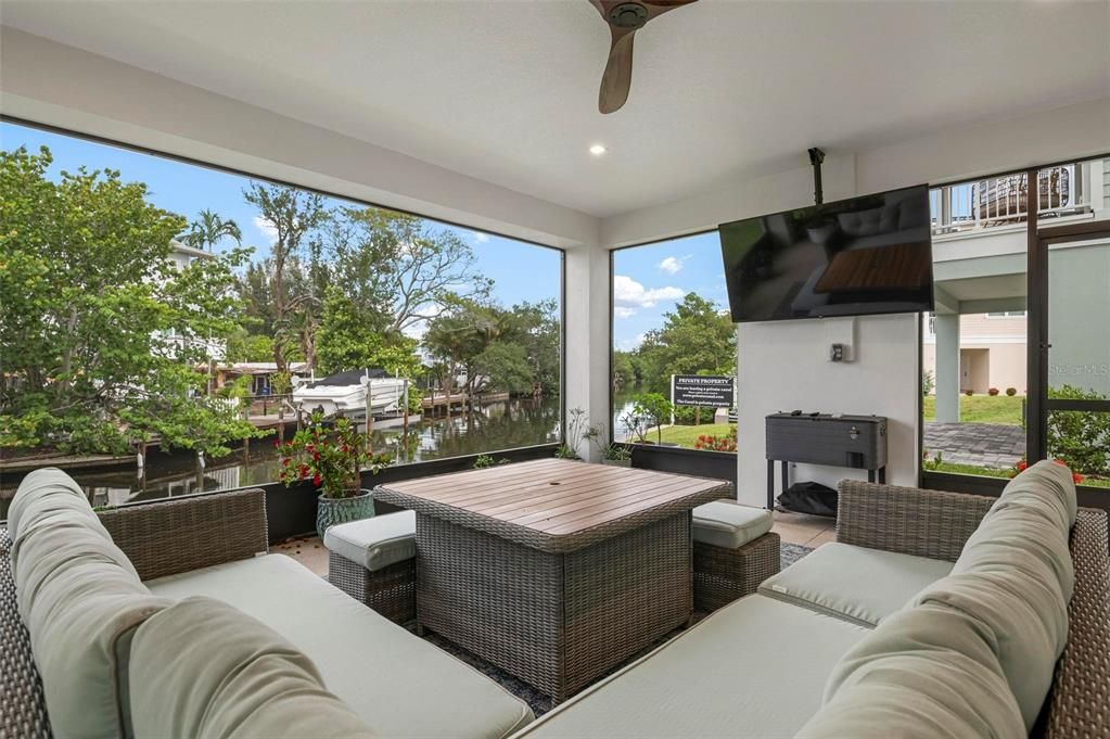 Ground level screened patio overlooking the peaceful canal