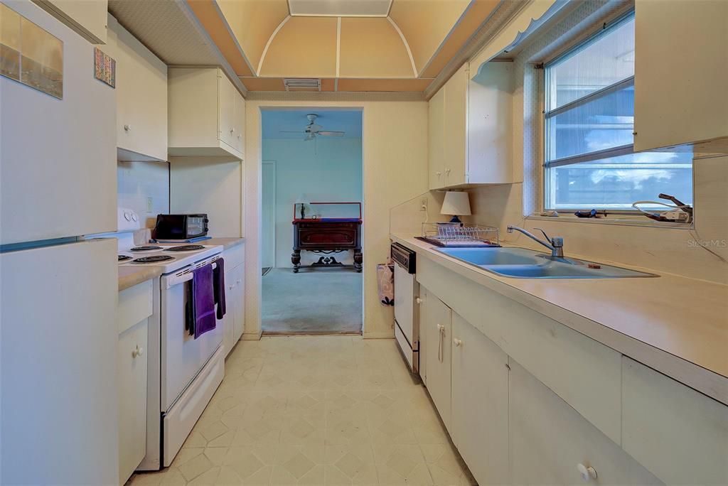 Very functional kitchen with access to both the living room and dining room.