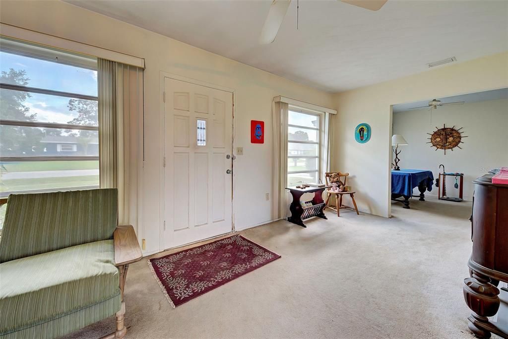 Entering the front door, you have a spacious living room with a dining room to your left.